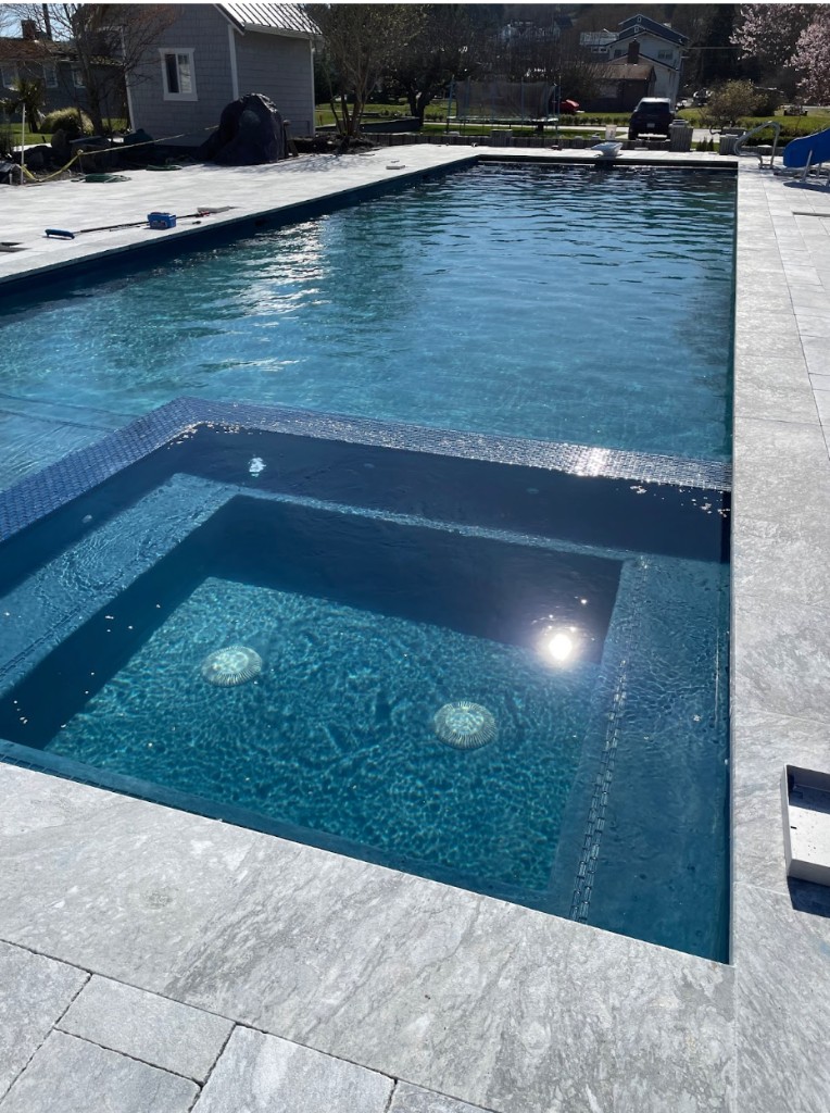 Cascade Poolworks pool and spa at dusk